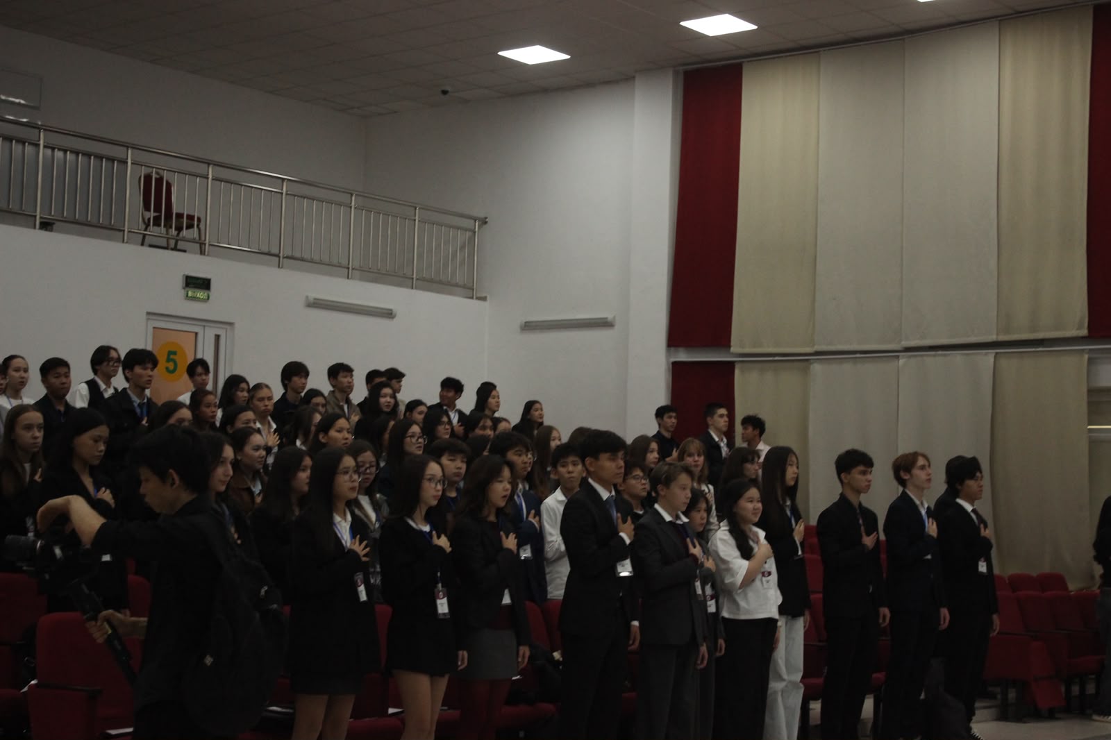 Students standing for the opening ceremony